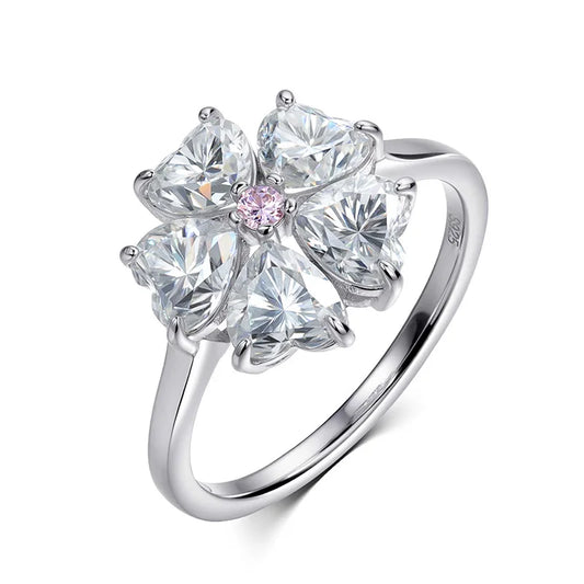 Silver ring with clear gemstones on a white background