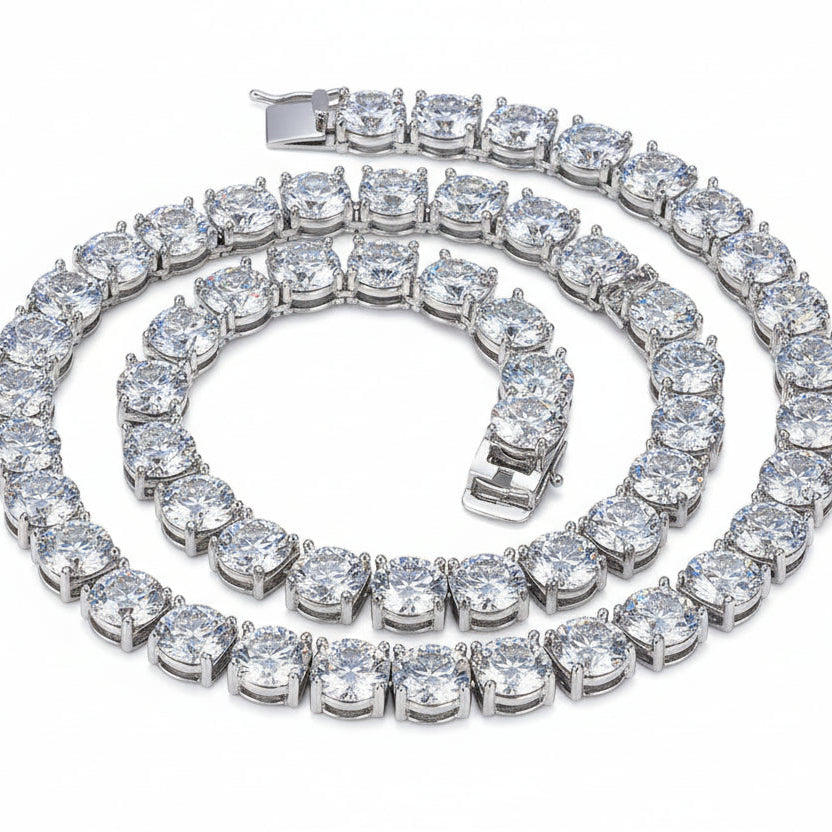 Silver bracelet with large clear gemstones on a black background