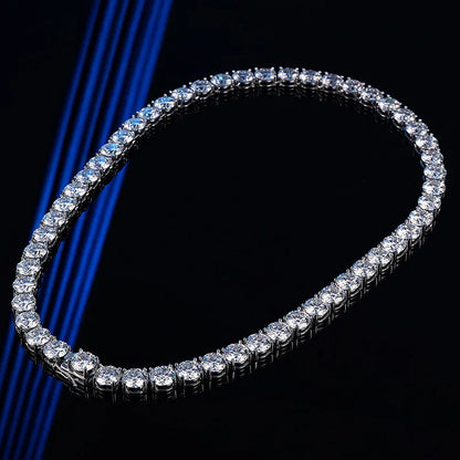 Diamond tennis bracelet on a black background with blue lighting
