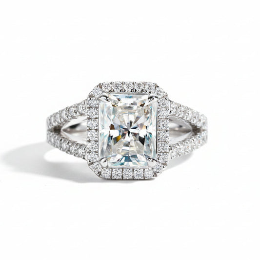 Elegant ring with a large central stone on a teal background, Moissanite ring