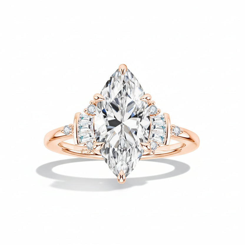 Rose gold ring with a pear-shaped diamond on a light surface
