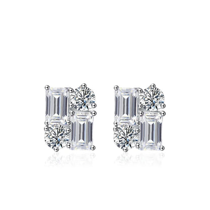 Pair of diamond earrings with emerald-cut and round-cut stones on a white background