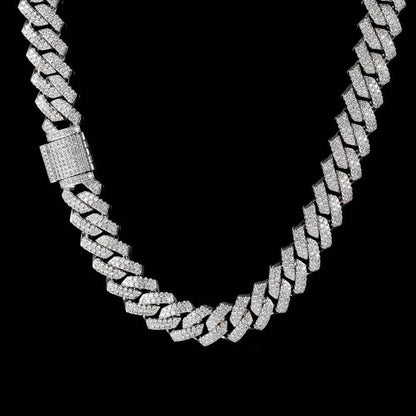 Silver chain necklace with diamond-like stones on a black background