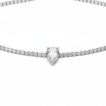 Diamond necklace on a black velvet stand with a blurred background