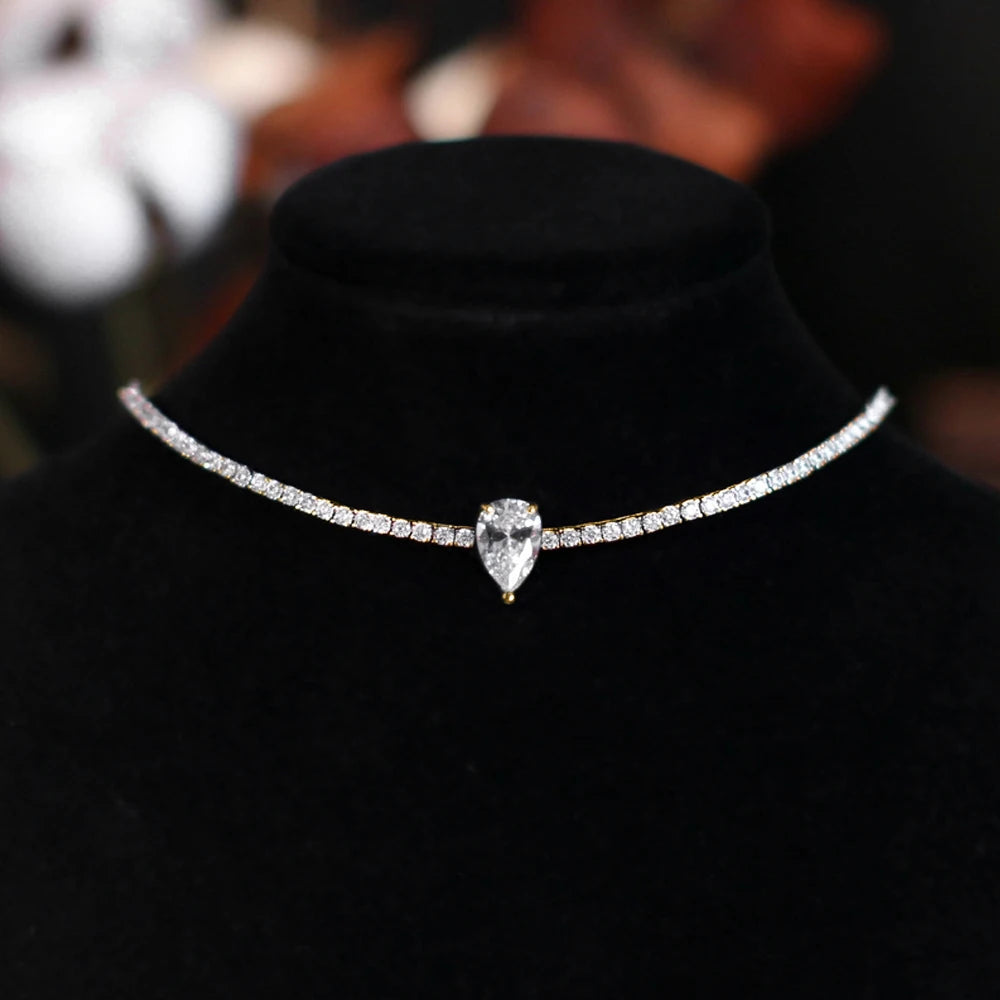 Necklace with a teardrop-shaped diamond on a black stand