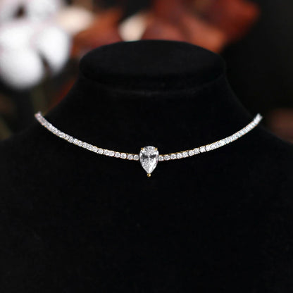 Necklace with a teardrop-shaped diamond on a black stand