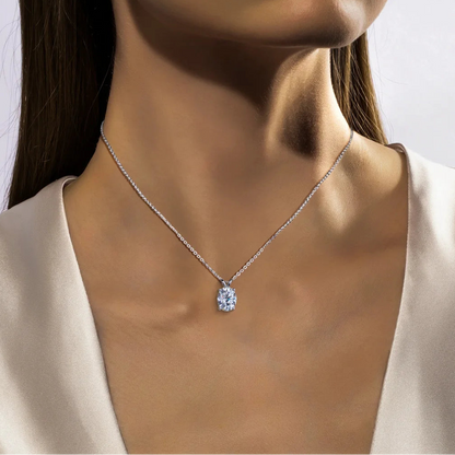 Necklace with a pendant worn by a model against a neutral background