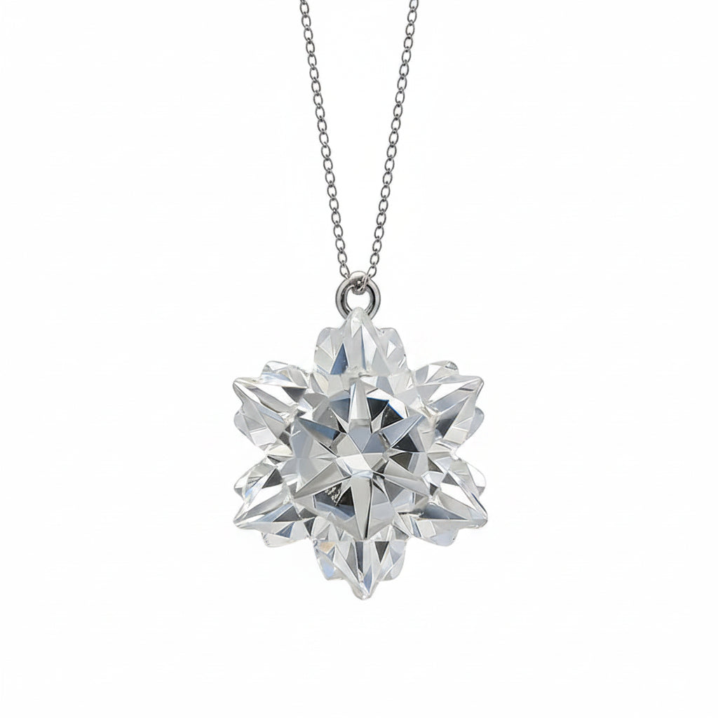 Diamond snowflake pendant on a chain against a light blue background