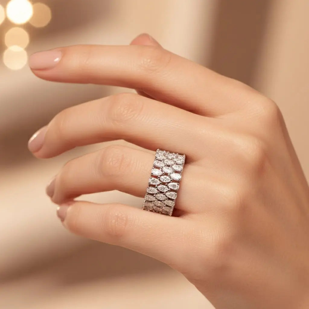 Close-up of pear and marquise cut moissanite eternity ring
