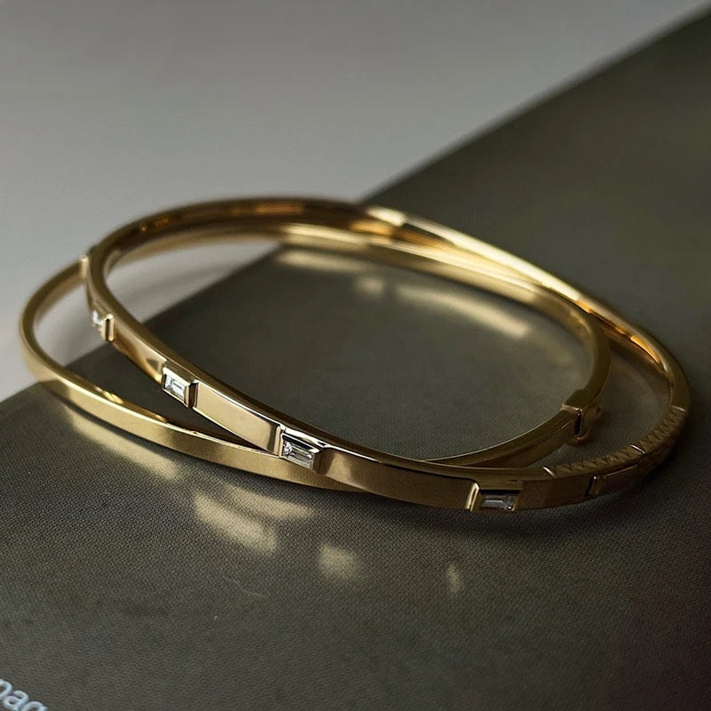 Love Design Bangle in 18K Yellow Gold with Natural Diamonds.