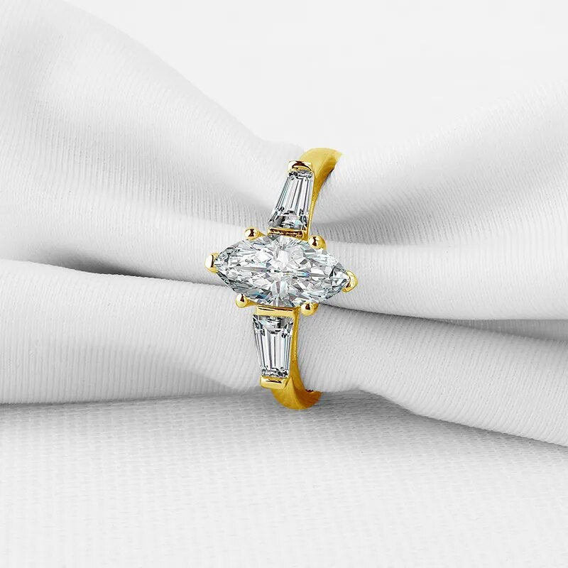 Marquise-Cut. Gold Moissanite Three-Stone Engagement Rings. 1.0 Carat. D VVS1.