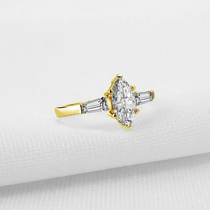 Marquise-Cut. Gold Moissanite Three-Stone Engagement Rings. 1.0 Carat. D VVS1.