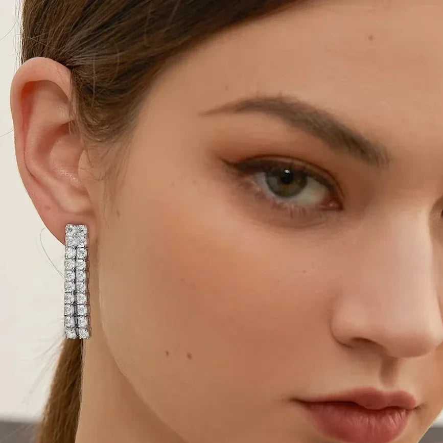 Side view of silver double row Moissanite earrings