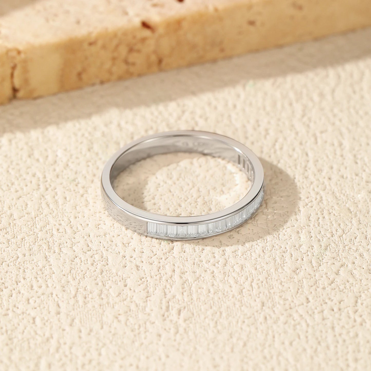 VK Diamonds stackable eternity rings with emerald cut moissanite