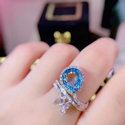 Blue Aquamarine and Natural Diamond Rings. 18K White Gold.