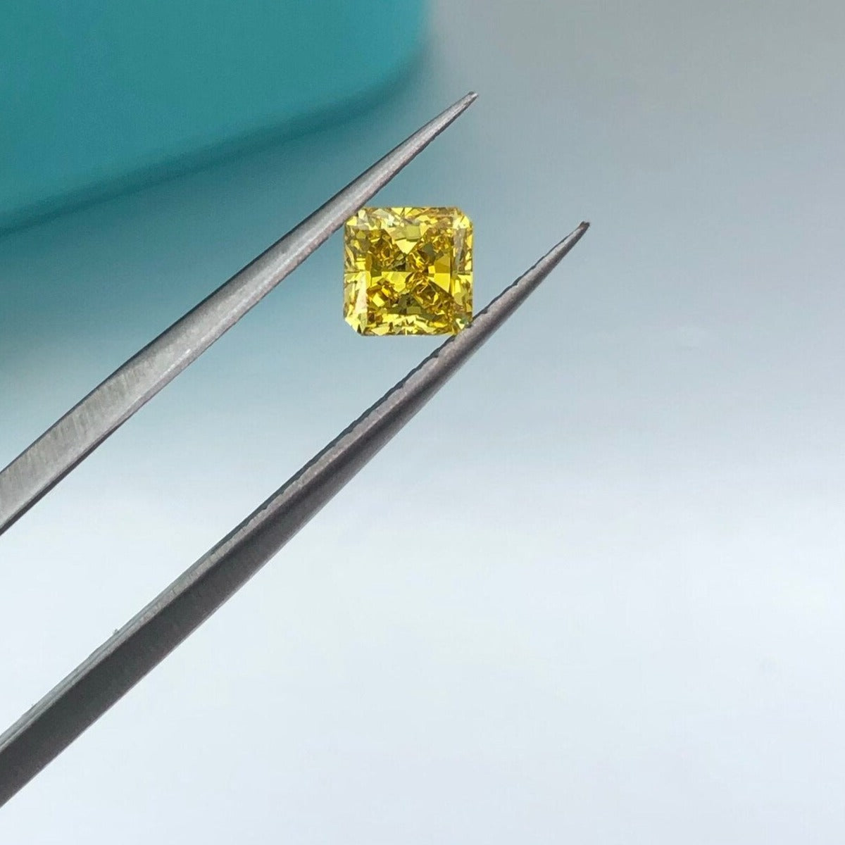 Fancy Intense Yellow Diamond. Radiant Cut. 0.69 Carat. Lab-Grown Diamond.